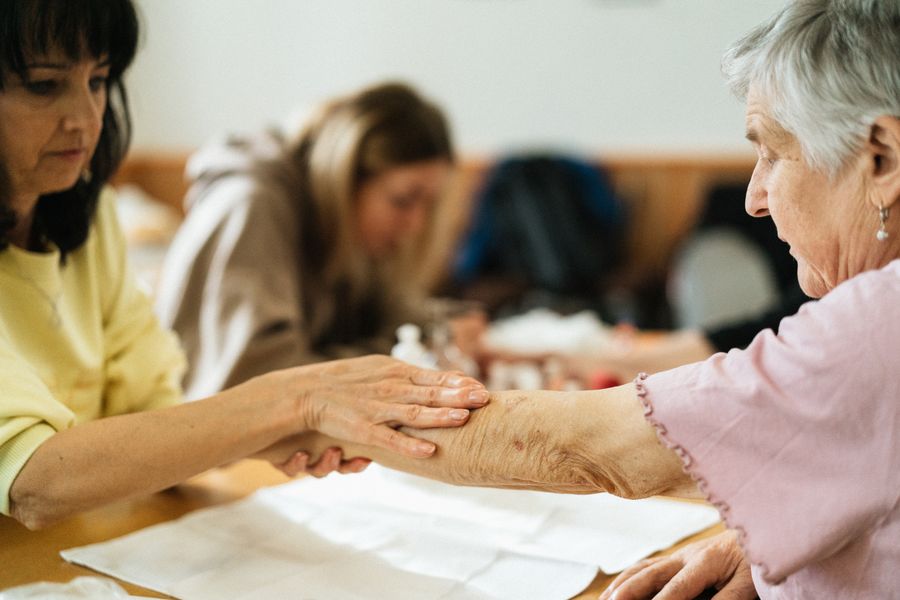 A caregiver and senior enjoying companionship together