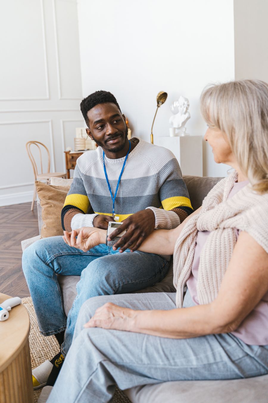 A Serenity caregiver checking in on a senior client at home